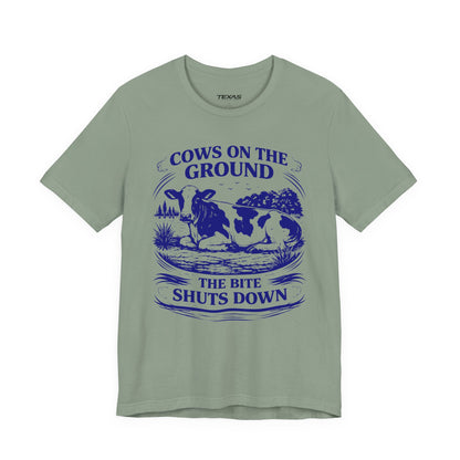 Cows on the ground, the bite shuts down — Unisex Cotton Tee