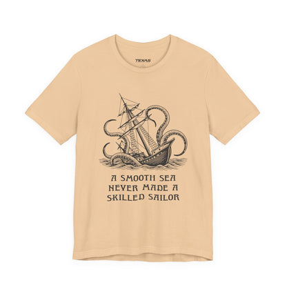 A smooth sea never made a skilled sailor — Unisex Cotton Tee