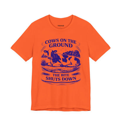 Cows on the ground, the bite shuts down — Unisex Cotton Tee