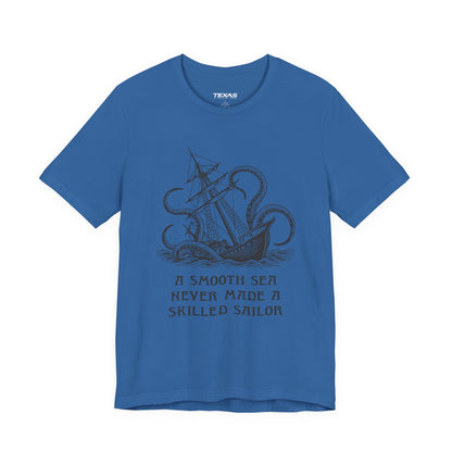 A smooth sea never made a skilled sailor — Unisex Cotton Tee
