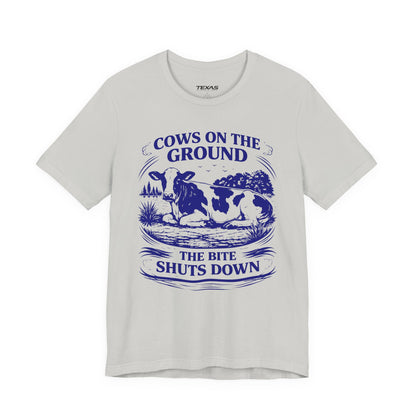 Cows on the ground, the bite shuts down — Unisex Cotton Tee
