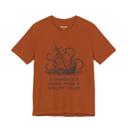 A smooth sea never made a skilled sailor — Unisex Cotton Tee