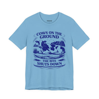 Cows on the ground, the bite shuts down — Unisex Cotton Tee