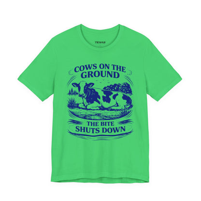 Cows on the ground, the bite shuts down — Unisex Cotton Tee