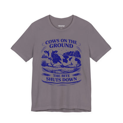 Cows on the ground, the bite shuts down — Unisex Cotton Tee